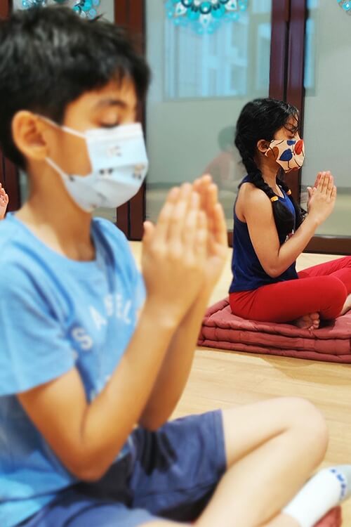 Kids doing yoga at Atmaanaan Wellness Centre, Dubai