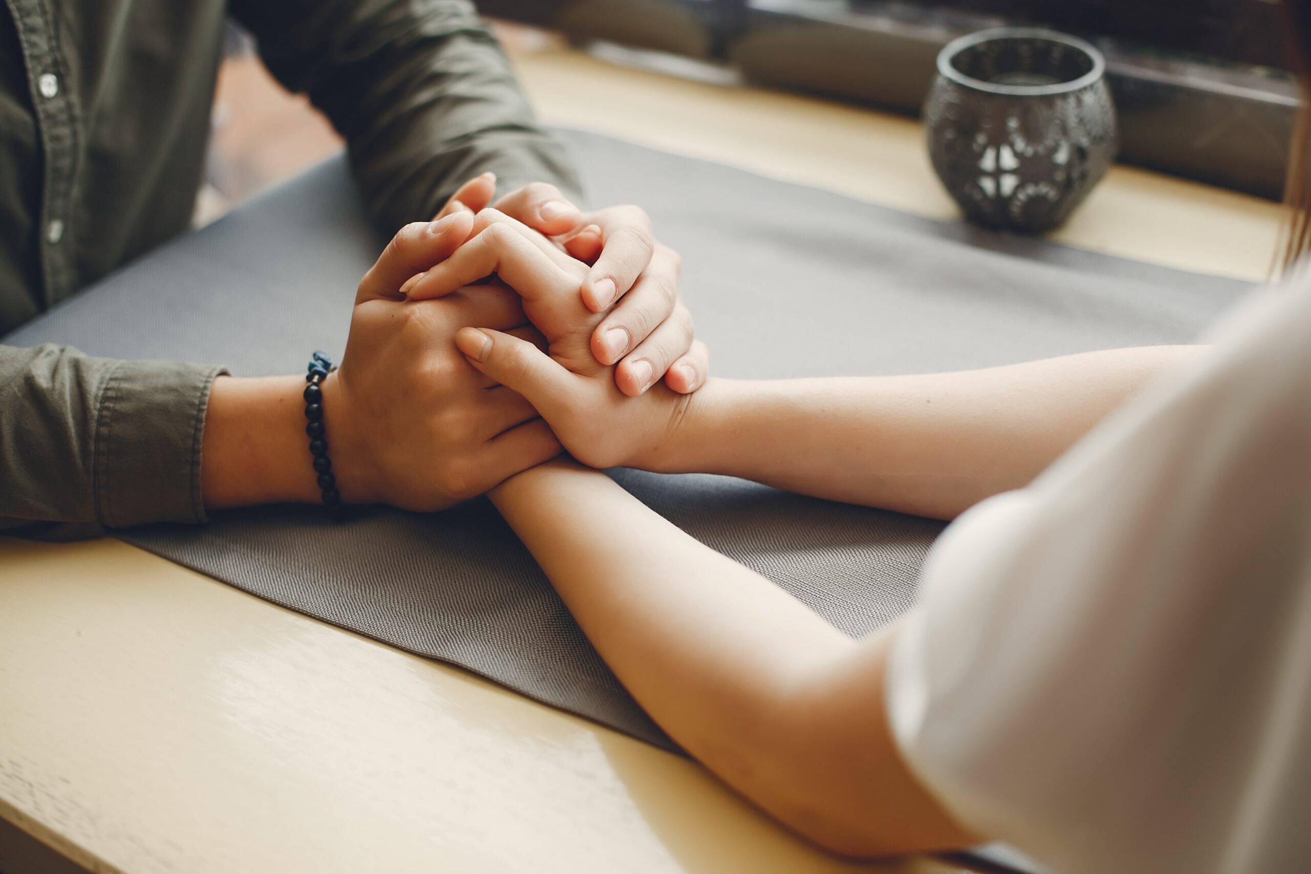 Man and woman holding hands forging a stronger relationship.
