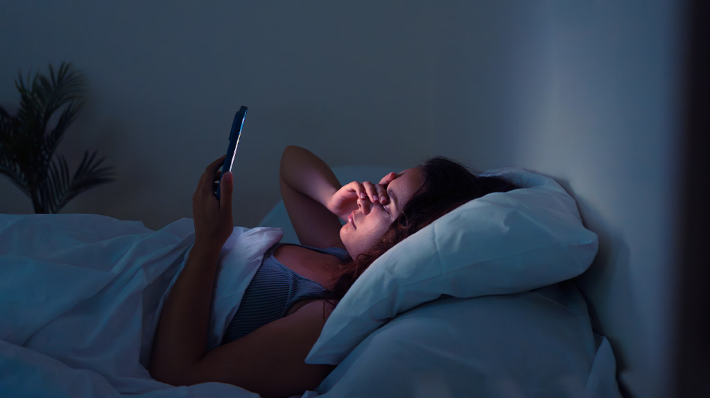 Woman sleeping peacefully after practicing CBT-I and relaxation techniques for insomnia relief.